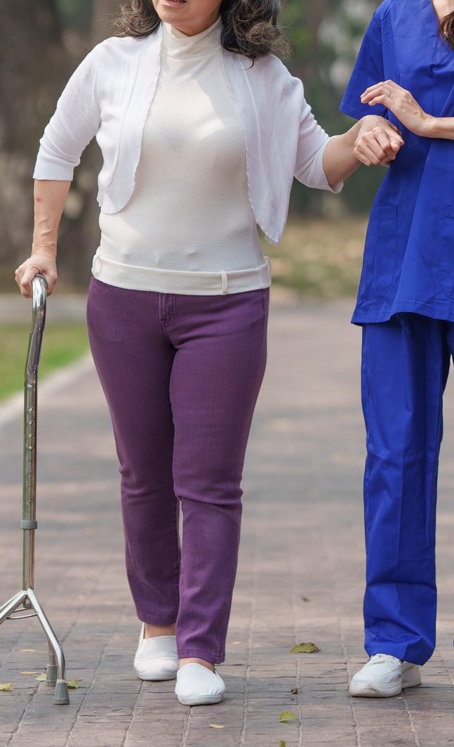 Healthcare nurse, physical therapy with elderly woman at outdoor. Nurse holding hand and help