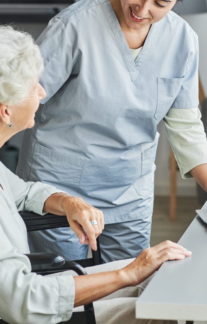 Nurse Assisting Senior Woman