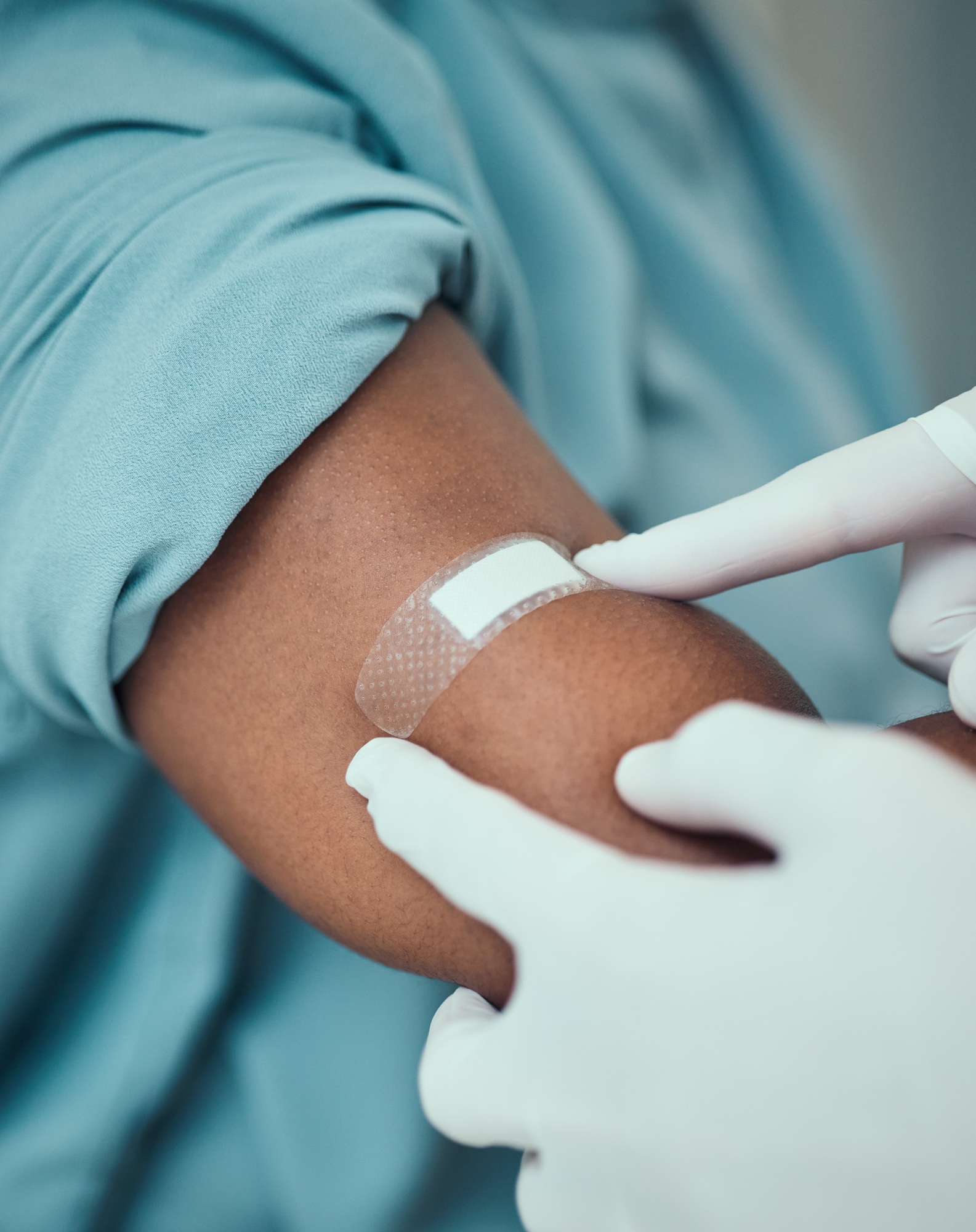 Plaster, vaccine and hands of doctor with patient with bandage for flu shot, injection and immunity
